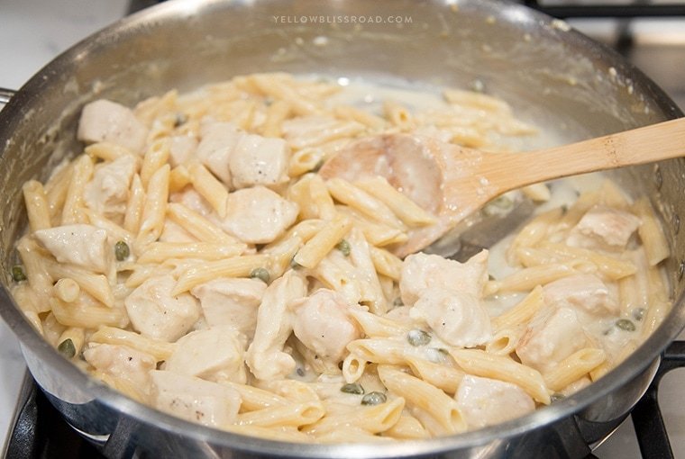 One Pan Creamy Lemon Chicken Picatta Pasta - Tender chicken and pasta are coated with a luscious lemony cream sauce with capers. Easy weeknight dinner that's classy enough for company.