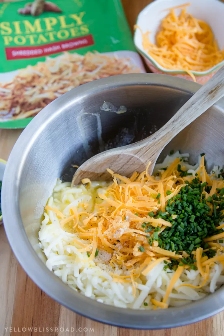 Ingredients mixing together in a bowl for Egg & Cheese Hash Brown Waffles