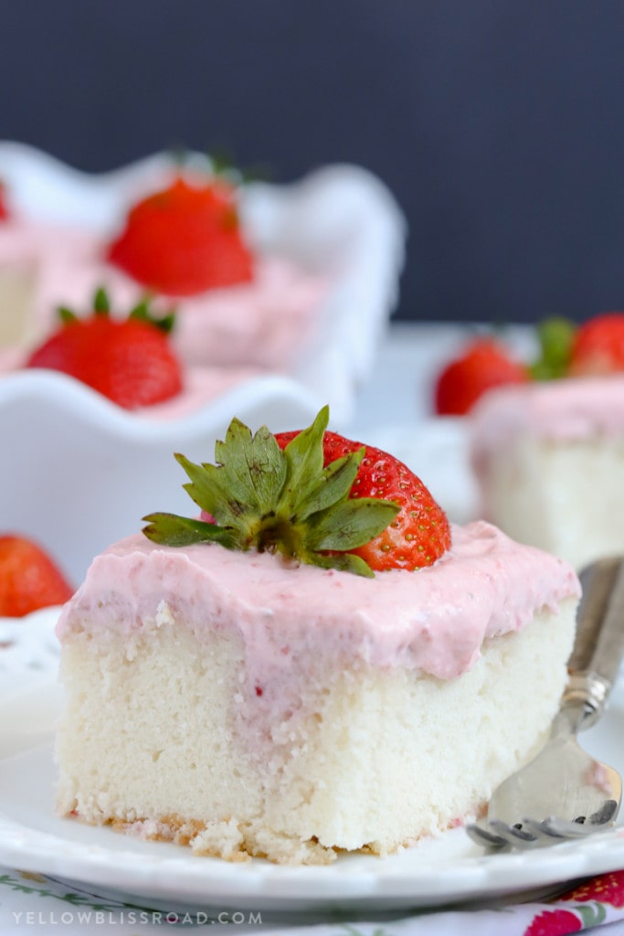 Strawberries and Cream Poke Cake with Strawberry Cream Cheese Frosting