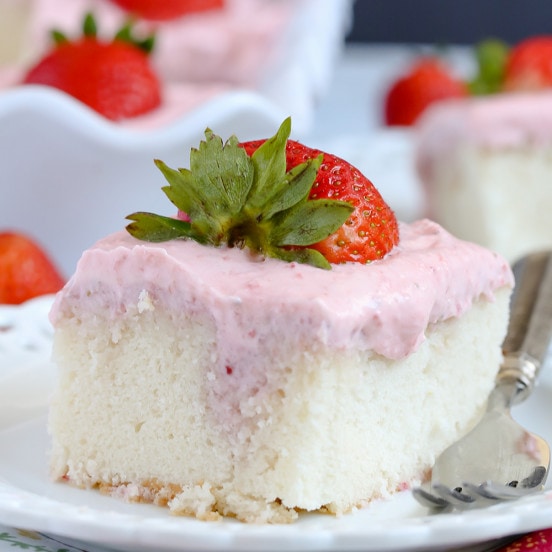 Strawberries and Cream Poke Cake with Strawberry Cream Cheese Frosting