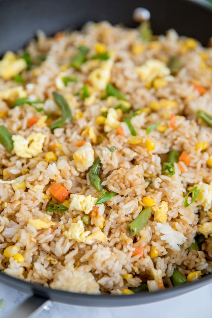 Easy Fried Rice with Egg and vegetables in a large skillet.
