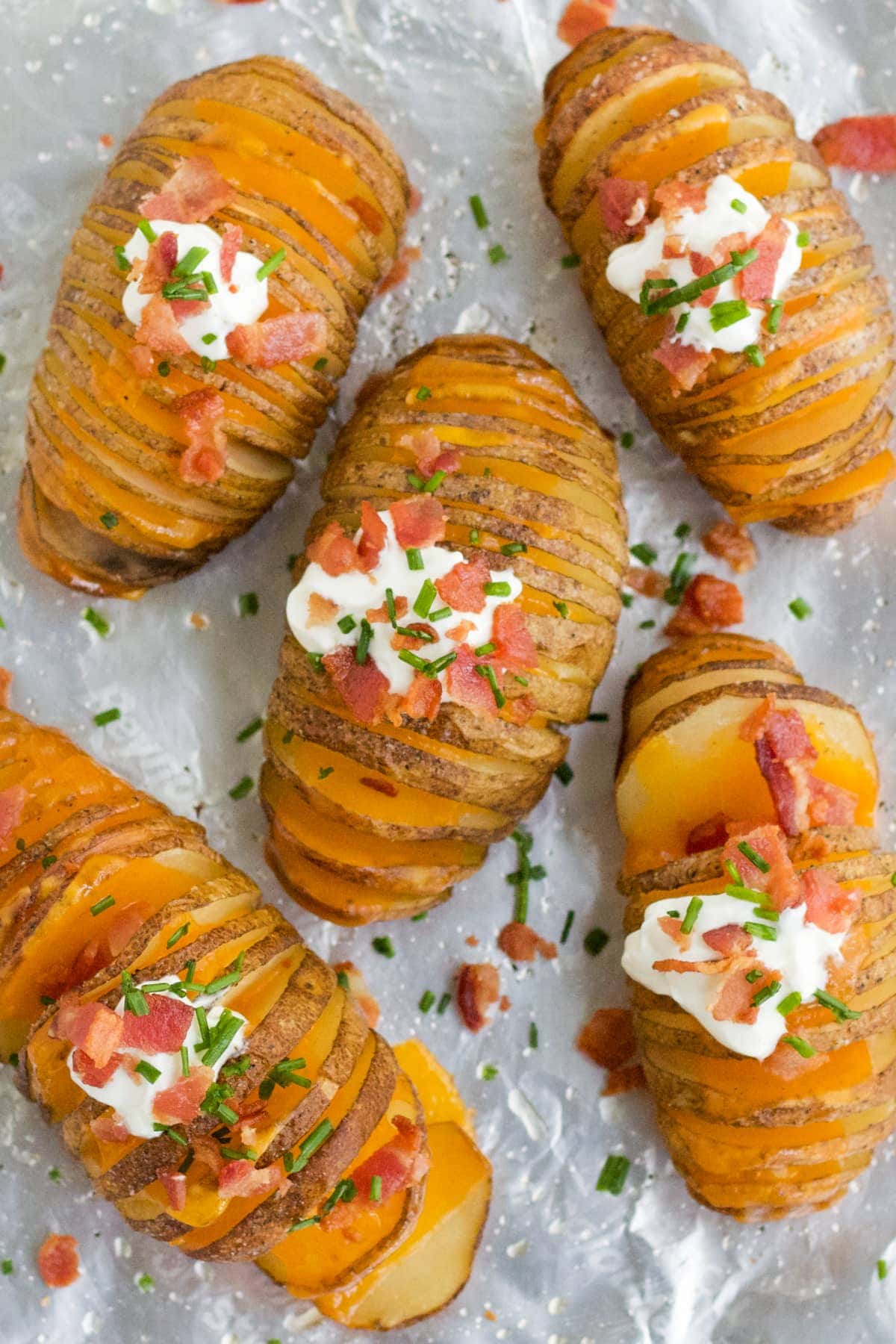 hasselback potatoes with sour cream, bacon and chives