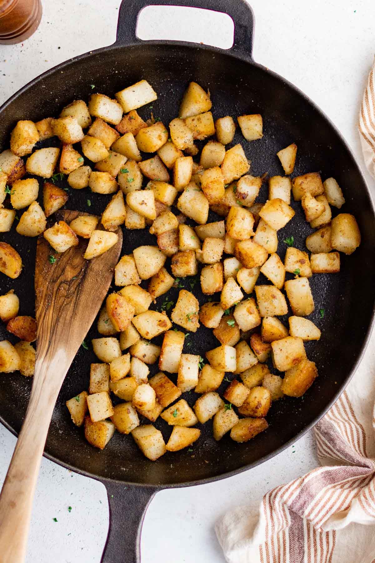 Gold Potatoes With Bacon in a Cast Iron Skillet 