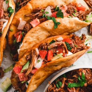 social media image for shredded beef tacos.