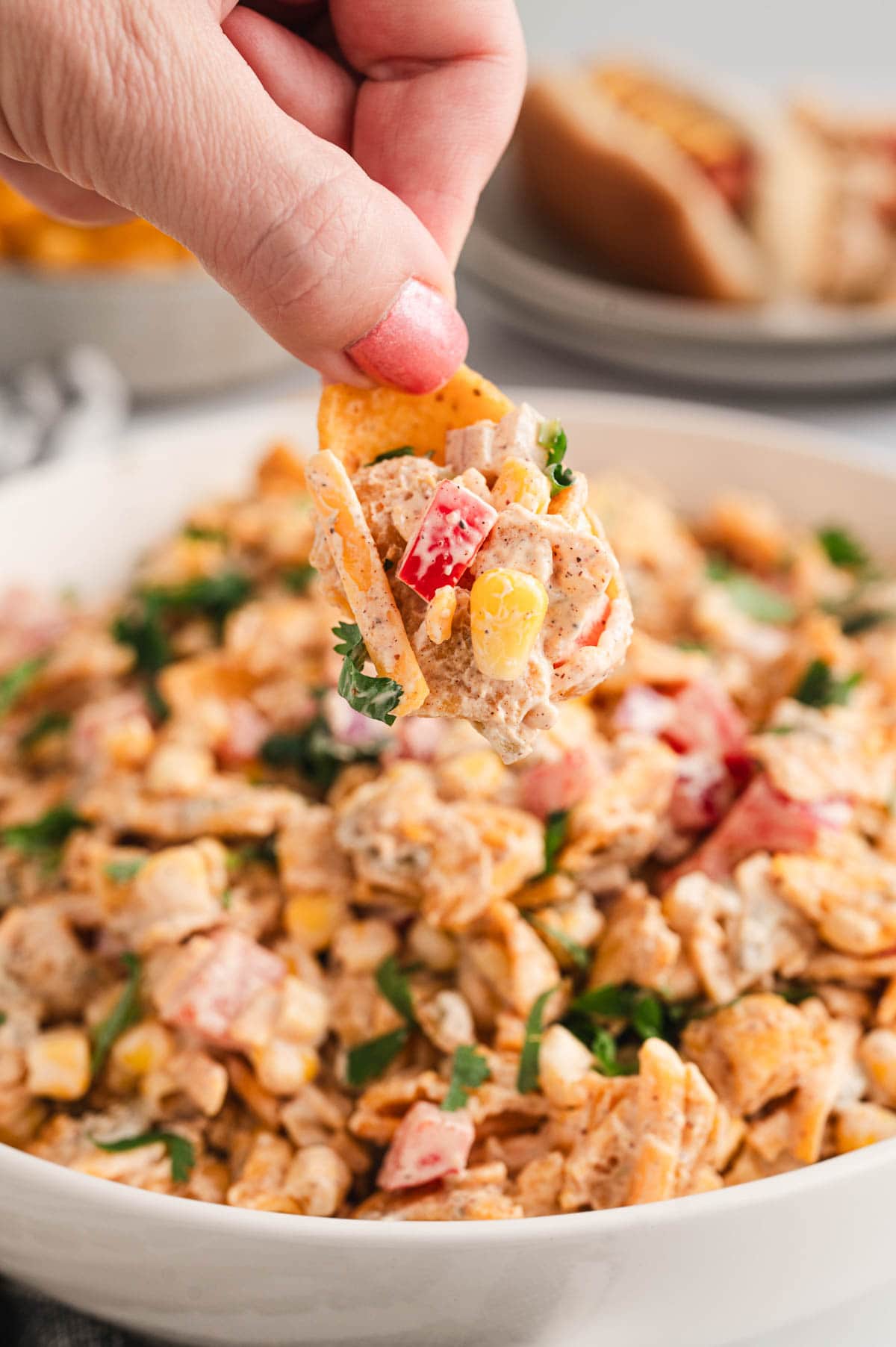 Frito corn salad with a frito scoop chip for dipping.
