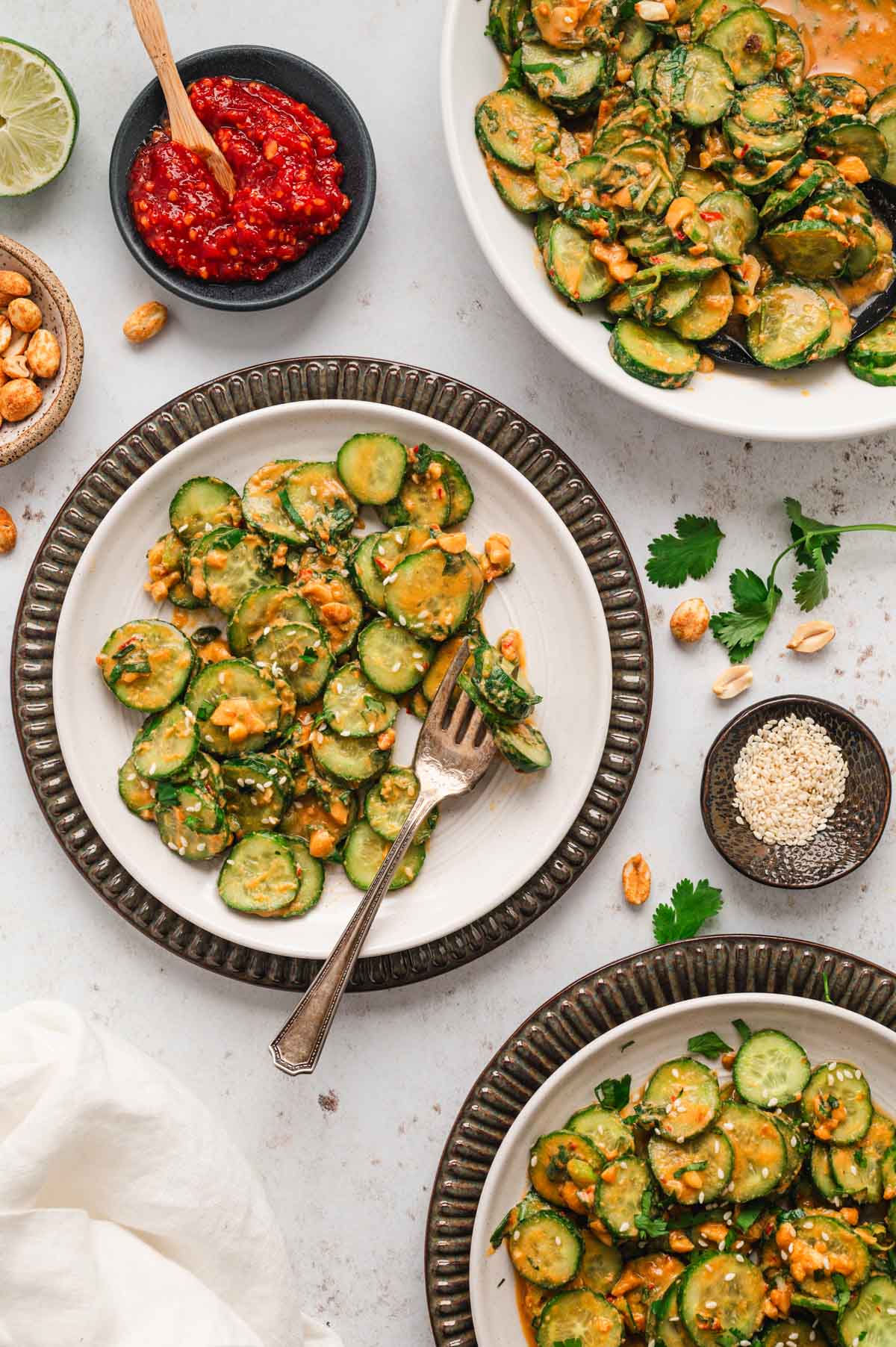 White plates with cucumber salad.