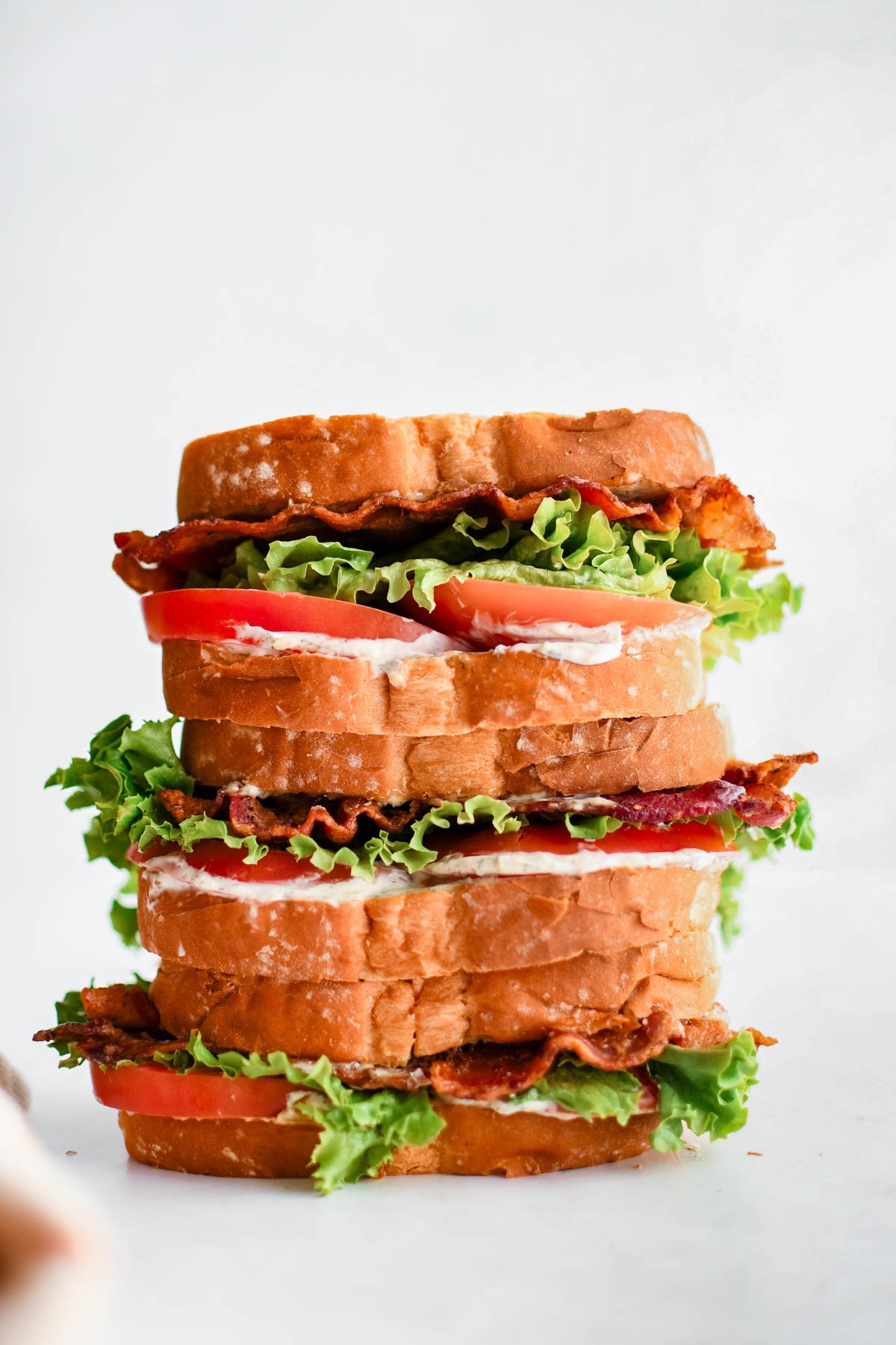 Stack of 3 blt sandwiches.