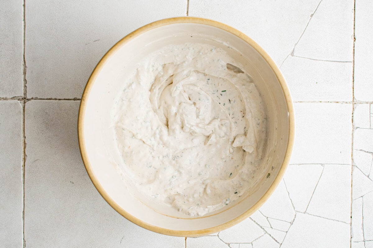 Mixed together chip dip in a bowl.