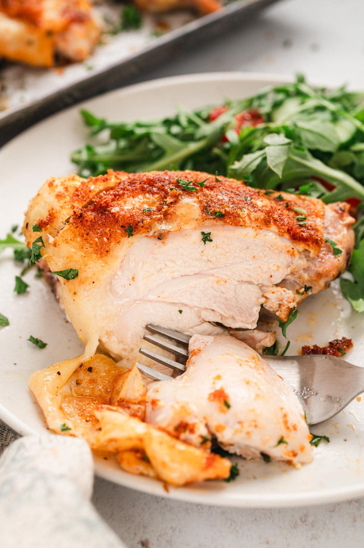 Crispy baked chicken thighs on a plate