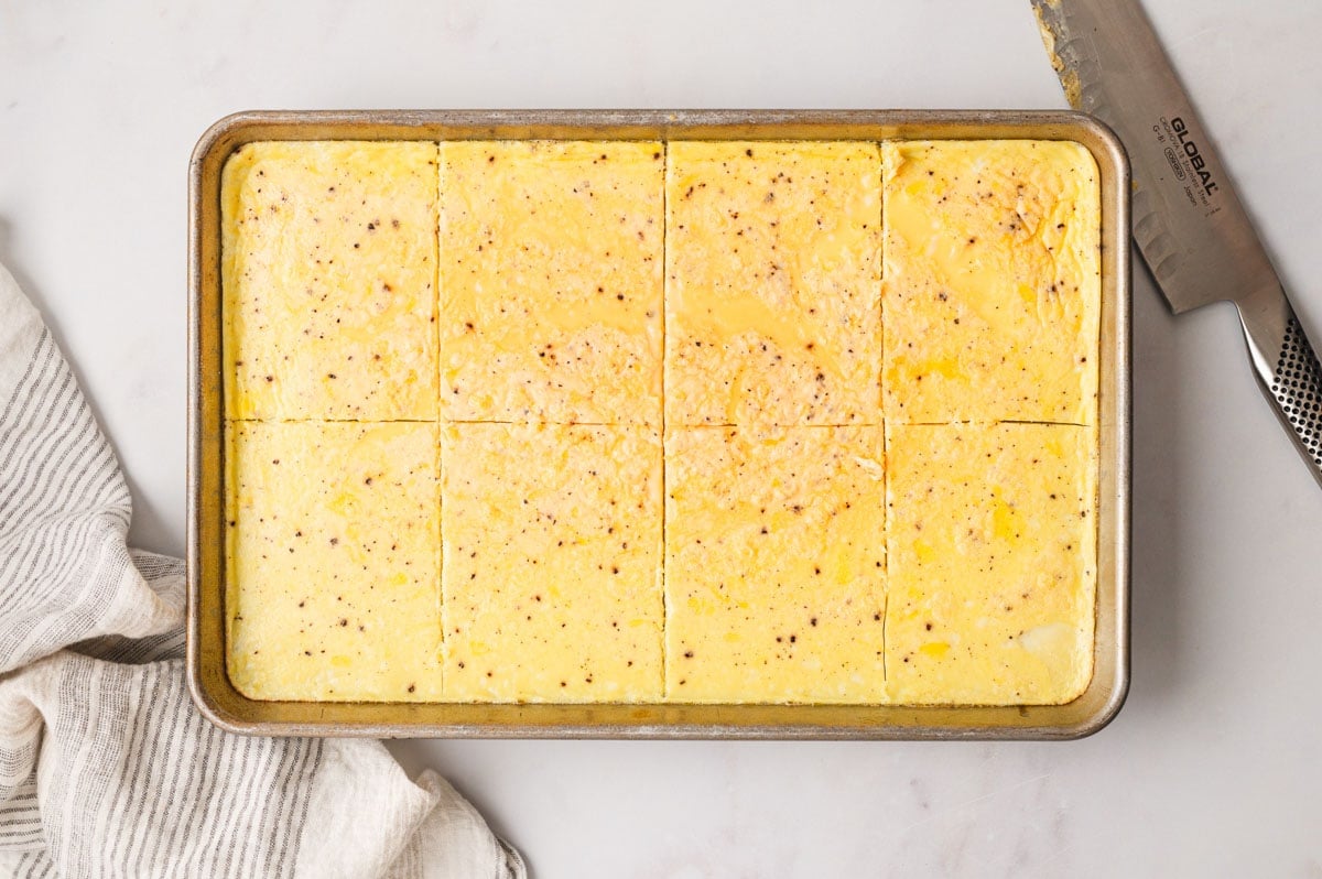 Cooked eggs on a sheet pan.