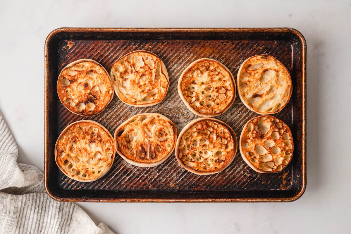 English muffins on a sheet pan.