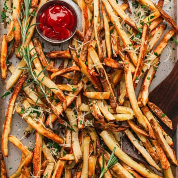 french fries with a dish of ketchup.