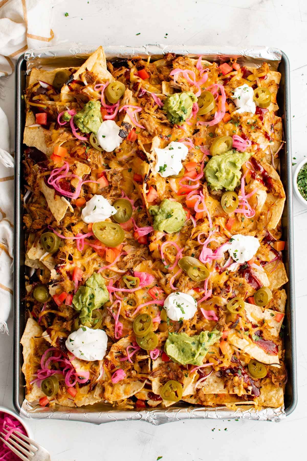 BBQ Pulled Pork Nachos on a sheet pan.