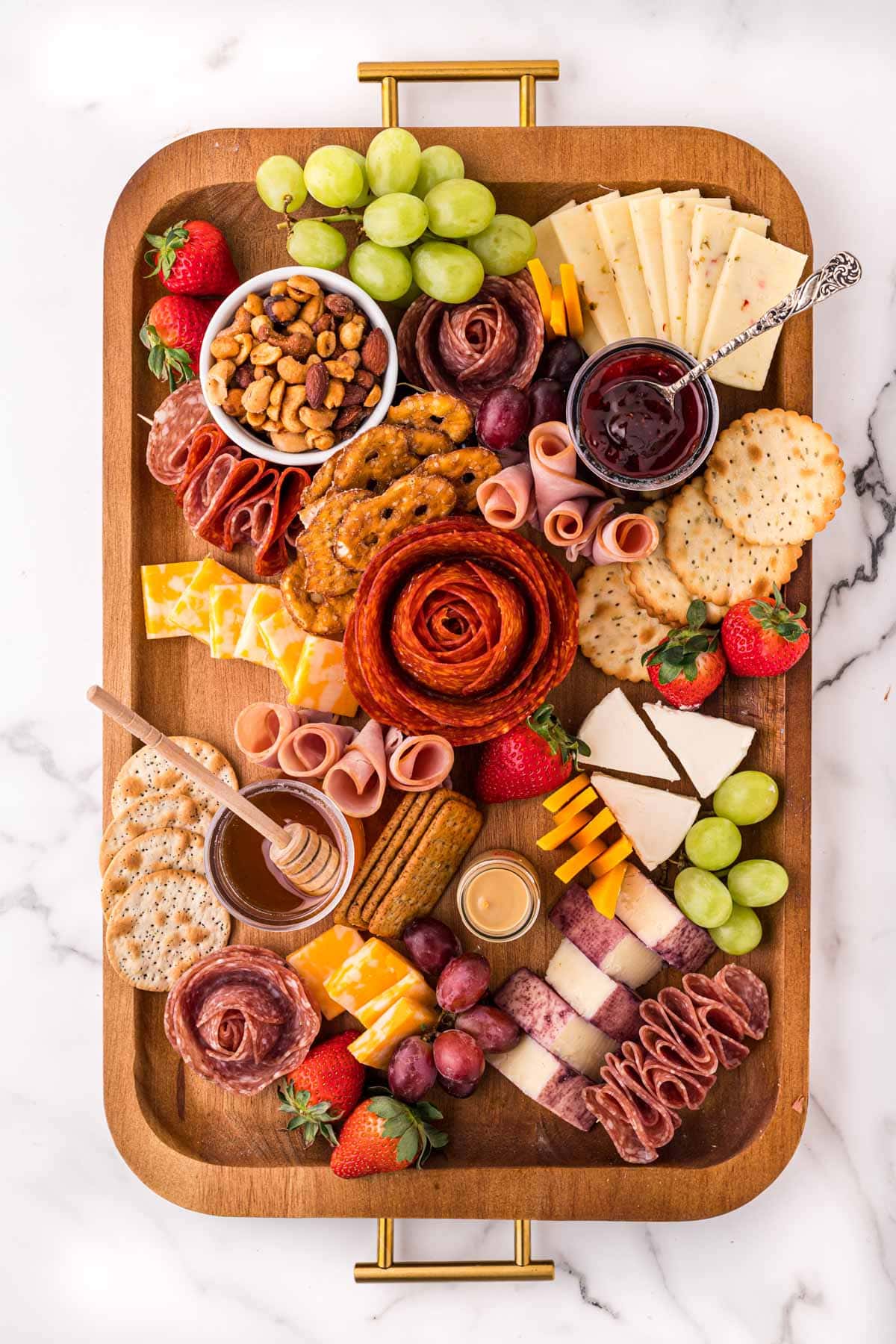 adding fruit to the meat and cheese board