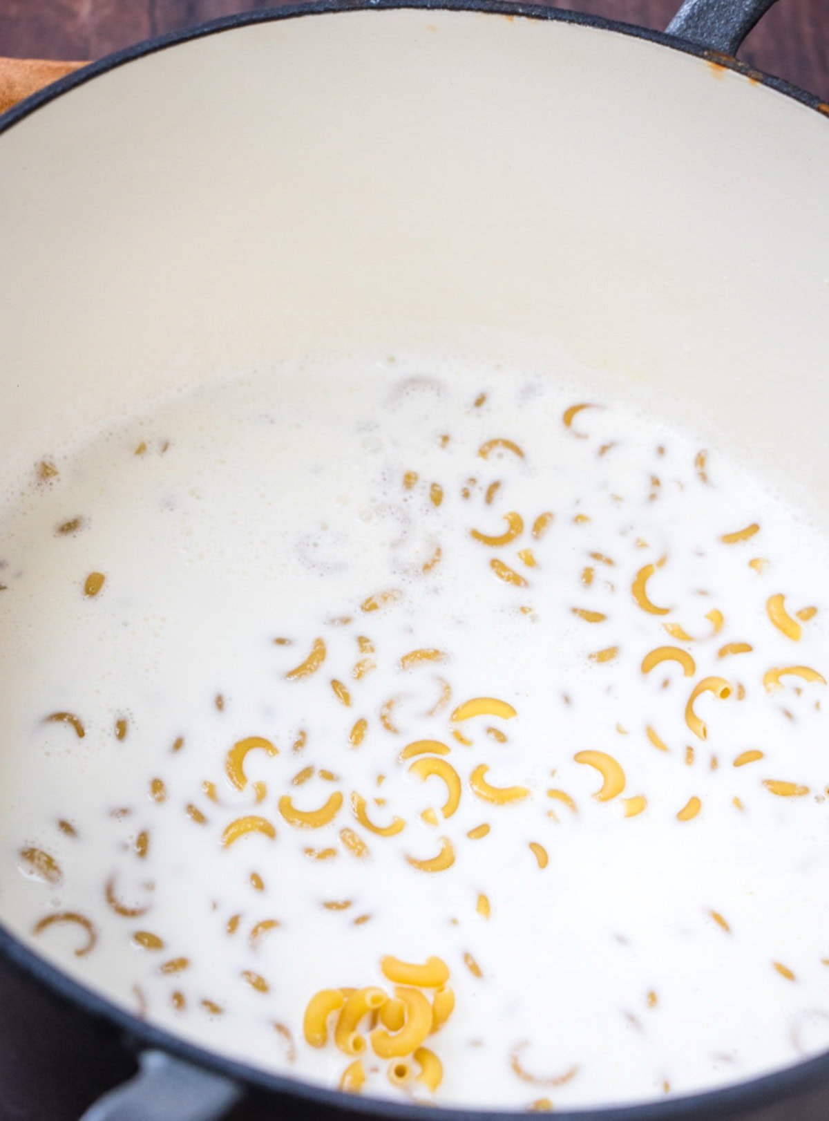 Macaroni simmering in milk. 