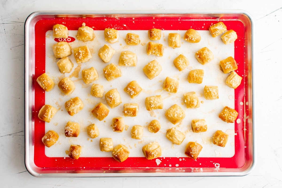 Baked pretzel bites on a baking sheet. 