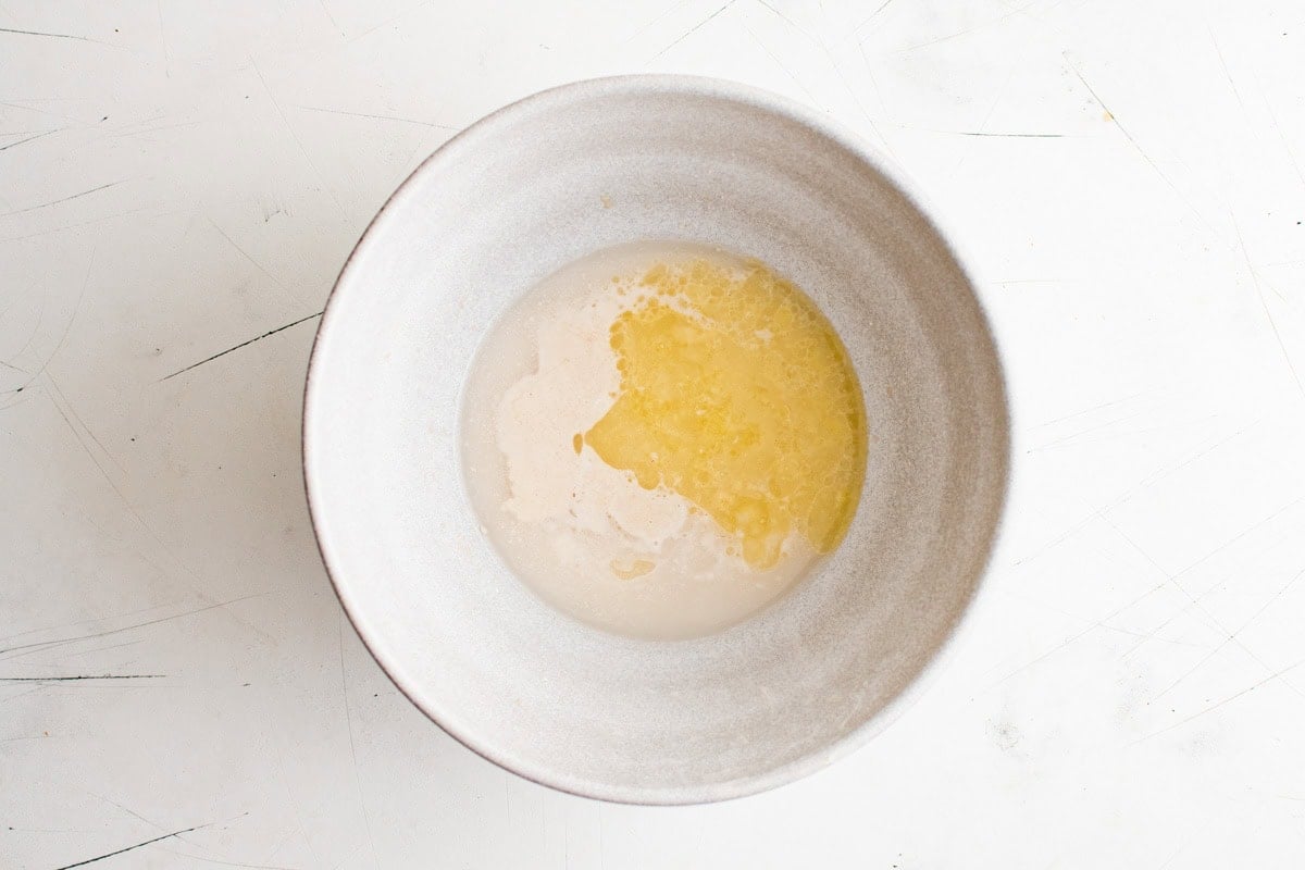 yeast with honey and melted butter in a bowl.