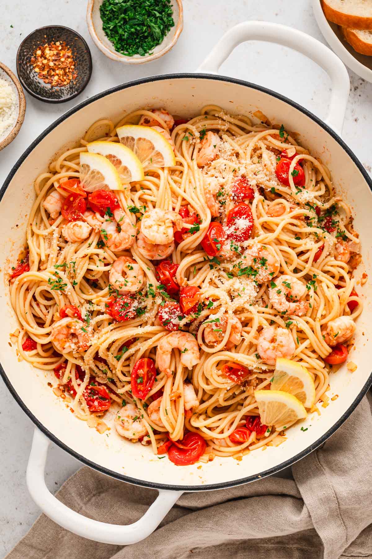 Shrimp and tomato spaghetti in a skillet. 