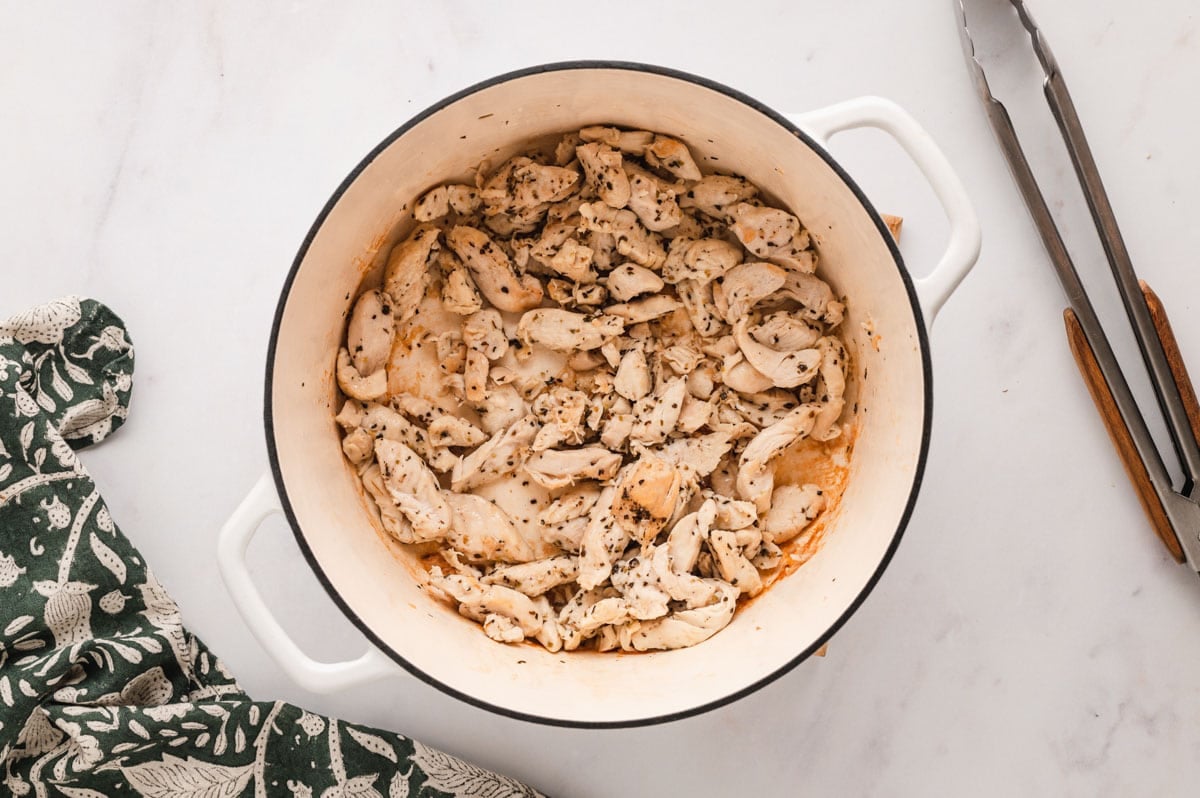 cooked chicken in a large pot.