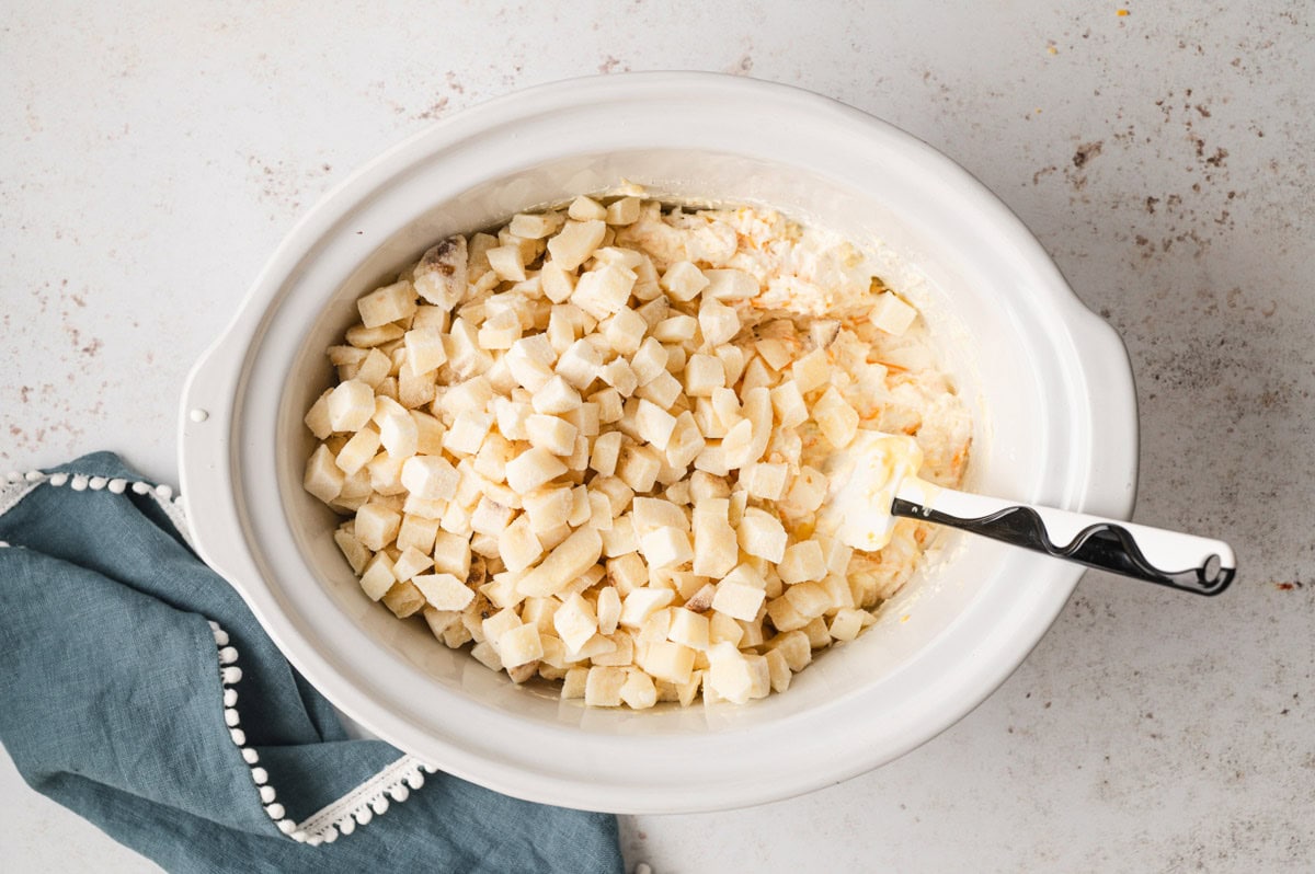 potatoes in a white slow cooker