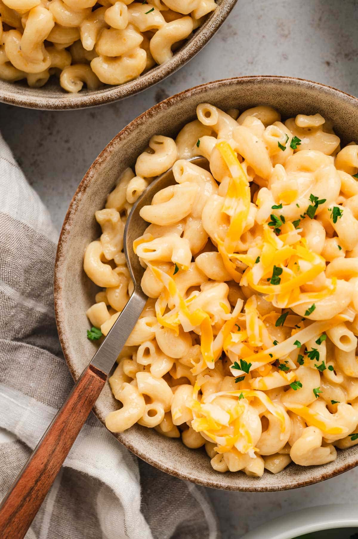 bowl with mac and cheese and a fork.