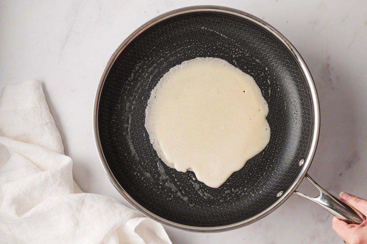 Crepe batter in a skillet