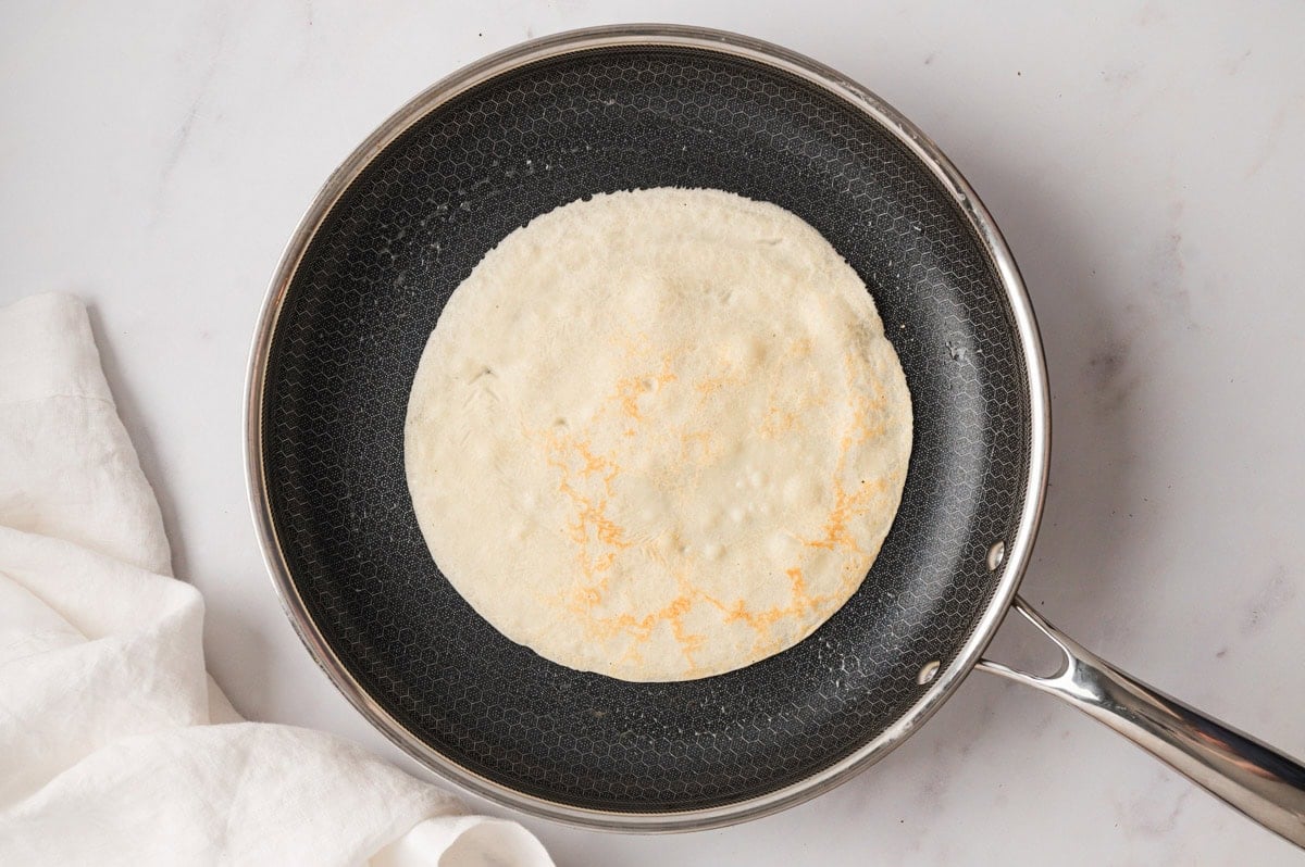 Crepe cooking in a skillet