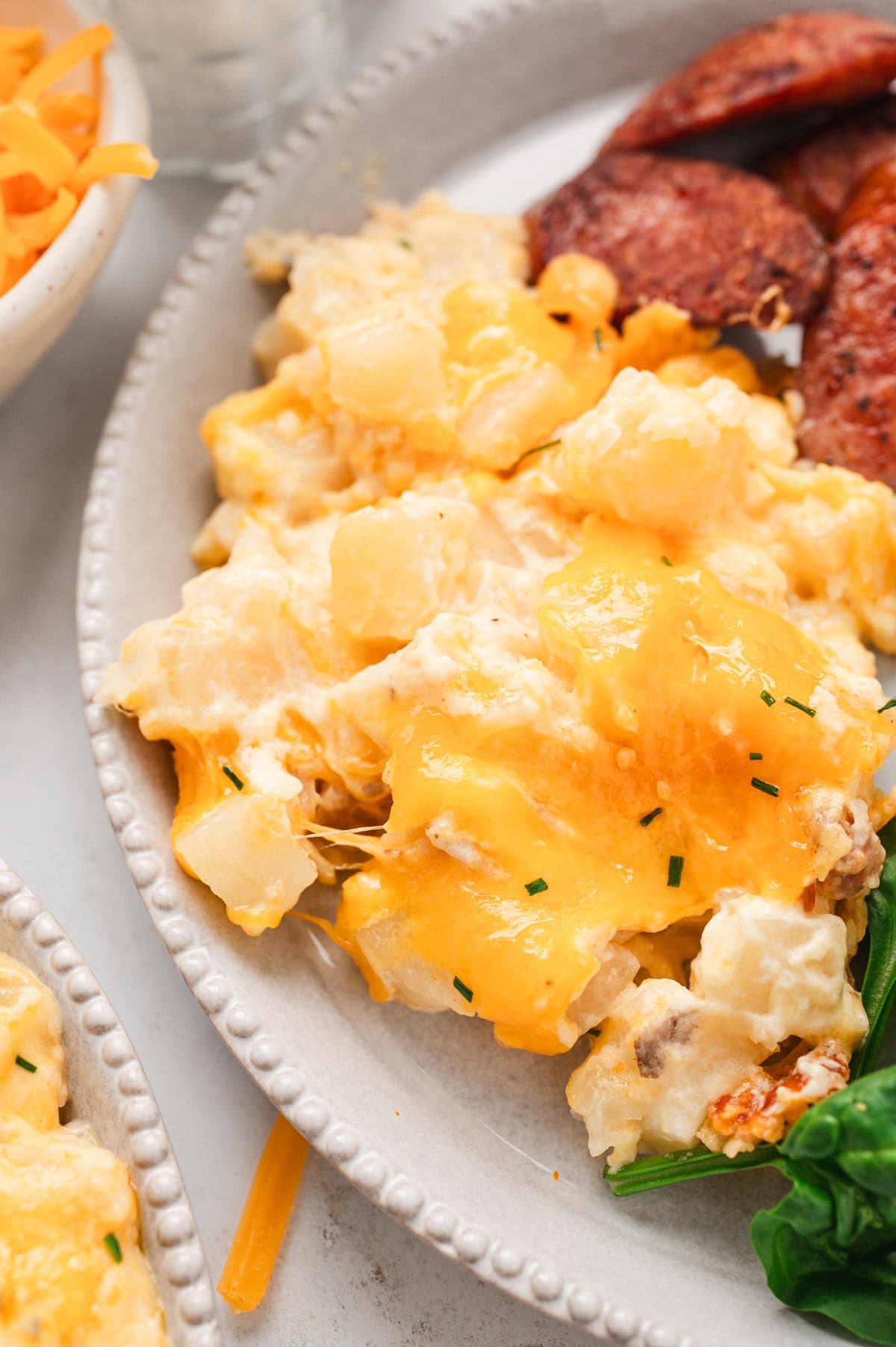 cheesy potatoes on a white plate