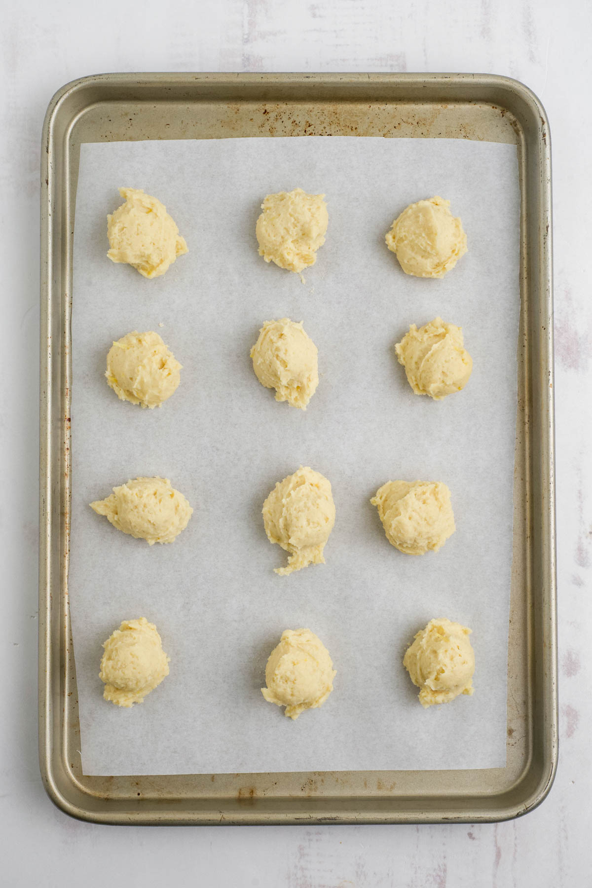 Cookie dough balls on parchment paper