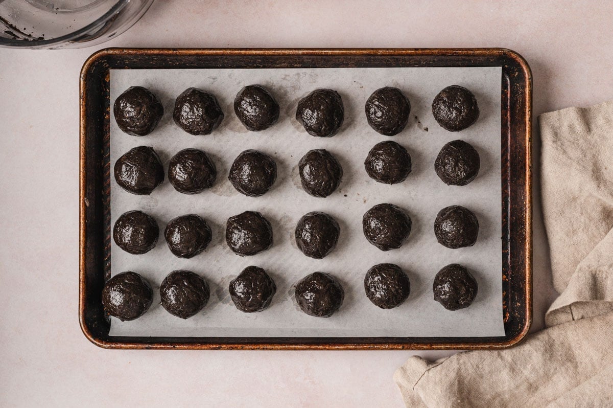 Oreo truffle balls on a baking sheet.