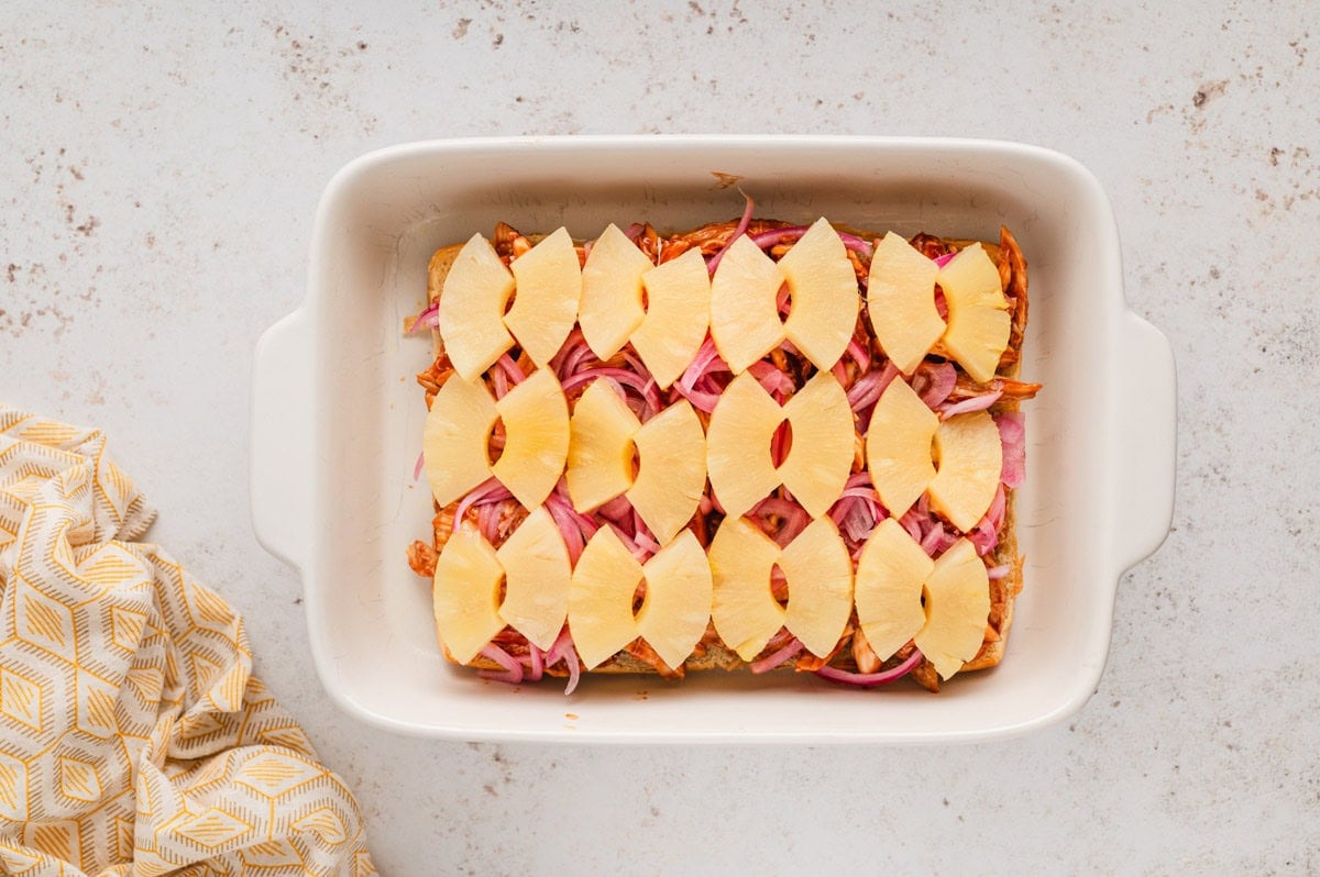 pineapple topped bbq chicken in a white dish