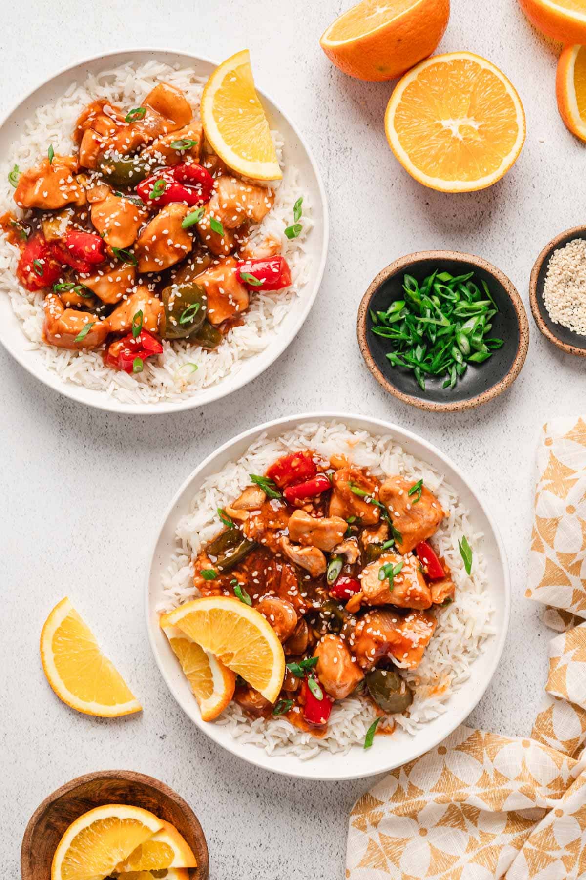 Plated with rice and orange chicken.